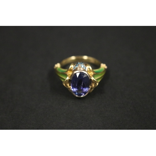 164 - 18ct gold antique style enamelled dress ring set with an oval cut tanzanite approx 2 carats, in orig... 