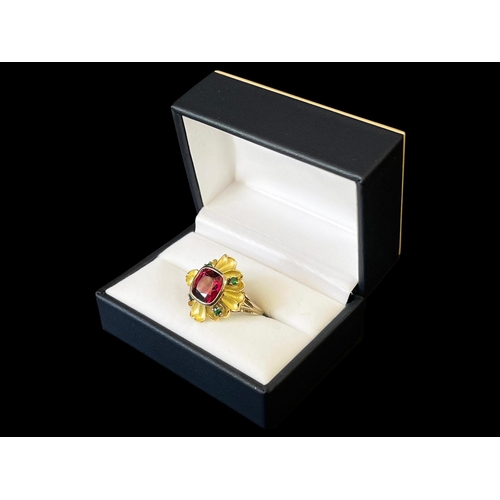 165 - 9ct and 18ct yellow and white gold flower design dress ring set with a large centre red stone and fo... 