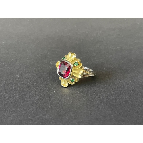 165 - 9ct and 18ct yellow and white gold flower design dress ring set with a large centre red stone and fo... 