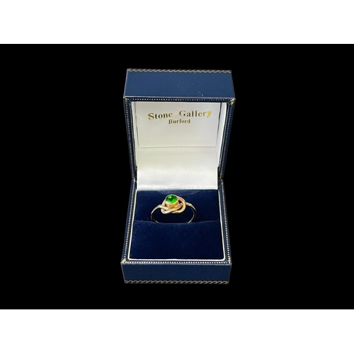 169 - Hallmarked 9ct gold knot designed ring set with green stone. Purchased from Stone Gallery, Burford U... 