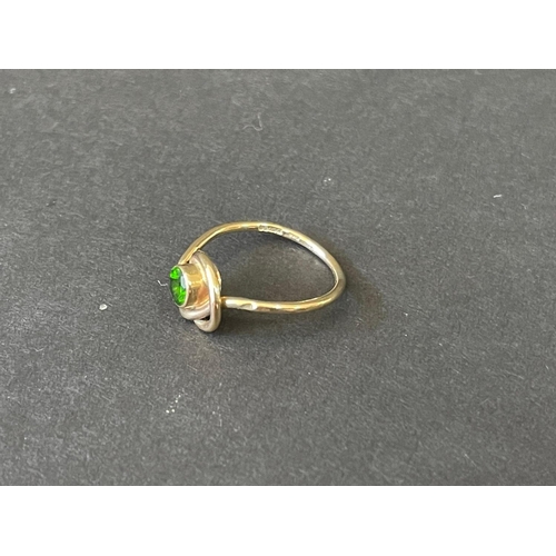 169 - Hallmarked 9ct gold knot designed ring set with green stone. Purchased from Stone Gallery, Burford U... 