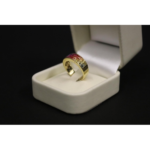 166 - 18ct yellow gold ring set with Parti coloured sapphires in a rainbow pattern, in original box. Purch... 