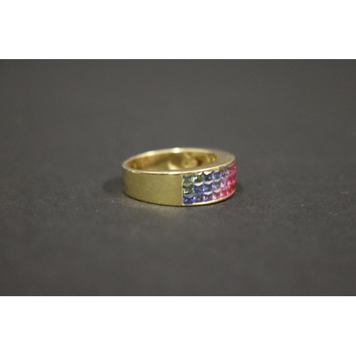 166 - 18ct yellow gold ring set with Parti coloured sapphires in a rainbow pattern, in original box. Purch... 