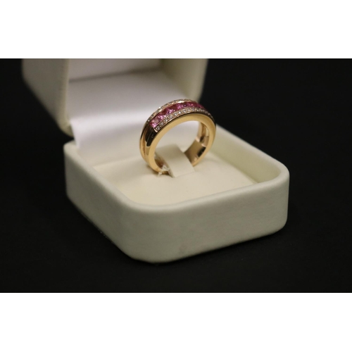 167 - 18ct rose gold ring set with pink sapphires and small diamonds, in original box. Purchased in Greece... 