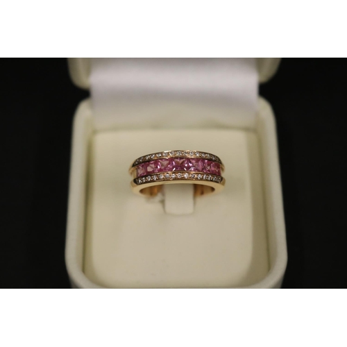 167 - 18ct rose gold ring set with pink sapphires and small diamonds, in original box. Purchased in Greece... 