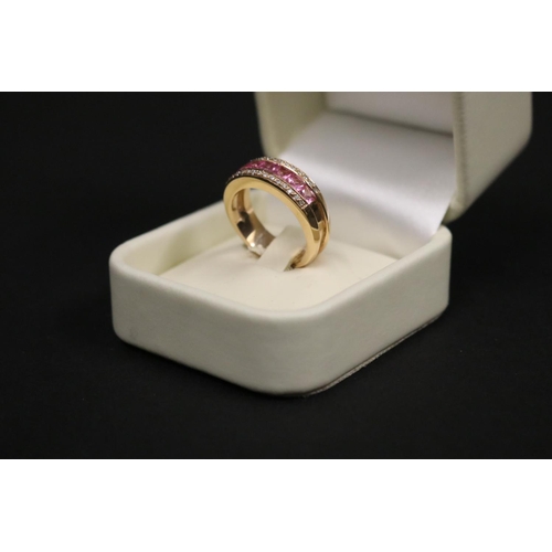 167 - 18ct rose gold ring set with pink sapphires and small diamonds, in original box. Purchased in Greece... 