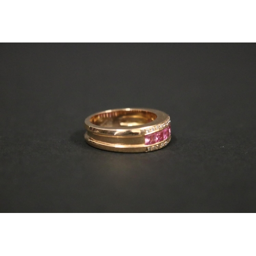 167 - 18ct rose gold ring set with pink sapphires and small diamonds, in original box. Purchased in Greece... 