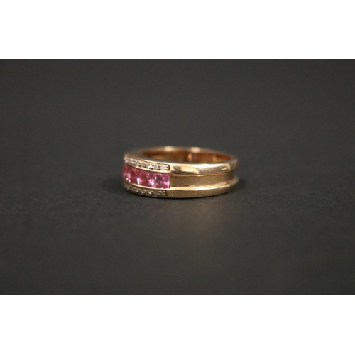 167 - 18ct rose gold ring set with pink sapphires and small diamonds, in original box. Purchased in Greece... 