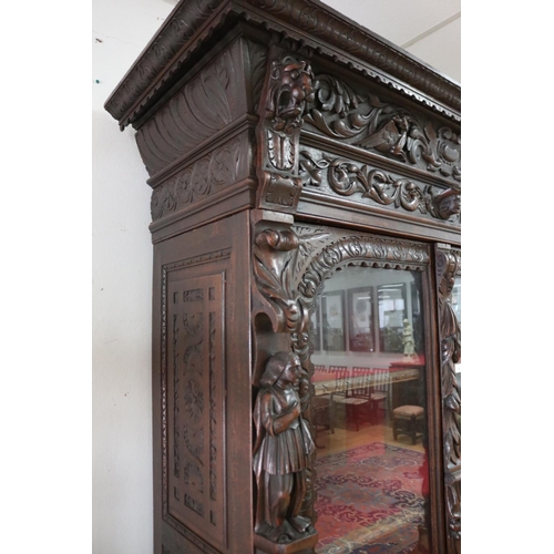 29 - Antique Flemish carved oak Renaissance - style two door bookcase, approx 232cm H x 150cm W x 57cm D