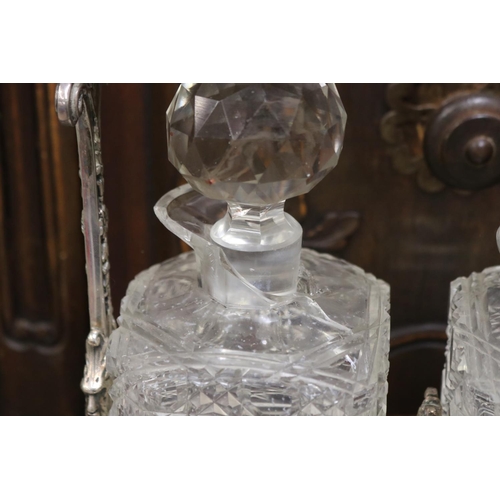133 - Antique English tantalus with three decanters, AF to one decanter, approx 32cm H x 38cm W