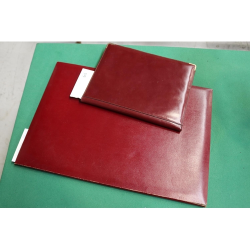 515 - Two red writing pads with leather case, approx 50cm X 35cm and smaller