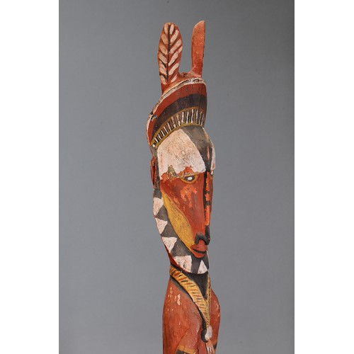 718 - Maprik Figure with large ears, Papua New Guinea. Carved and engraved hardwood and natural pigment. A... 
