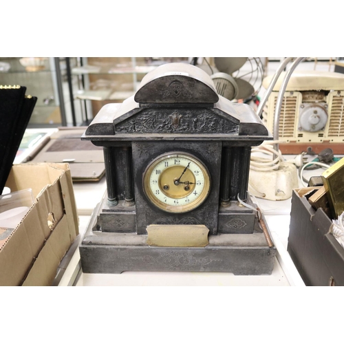 569 - Antique black slate mantle clock, with brass scroll presentation plaque, has key, no pendulum, unkno... 