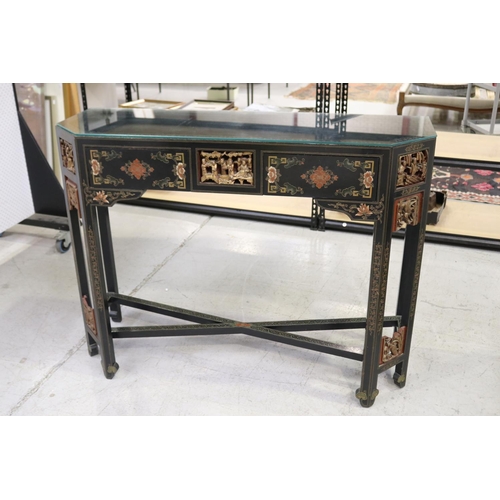 598 - Oriental hall table with two drawers. with chamfered gilt corners, each woth detailed carvings and c... 