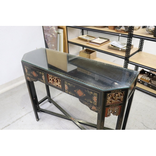 598 - Oriental hall table with two drawers. with chamfered gilt corners, each woth detailed carvings and c... 