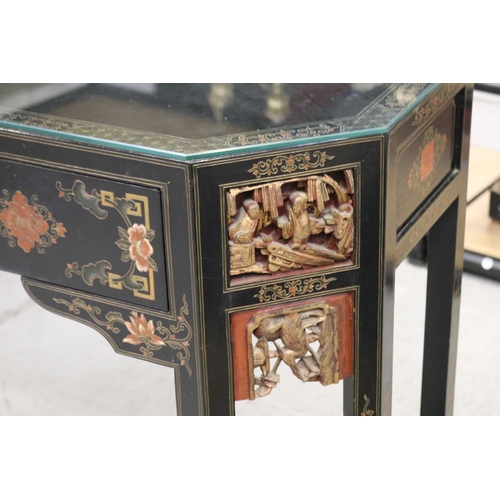 598 - Oriental hall table with two drawers. with chamfered gilt corners, each woth detailed carvings and c... 