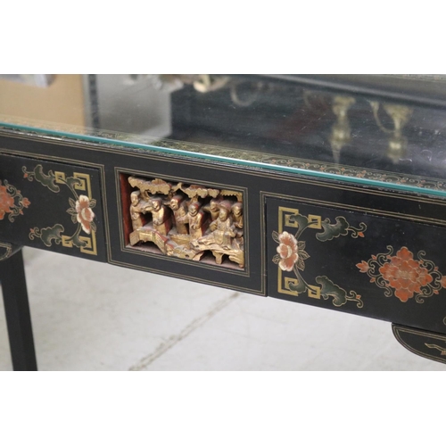 598 - Oriental hall table with two drawers. with chamfered gilt corners, each woth detailed carvings and c... 