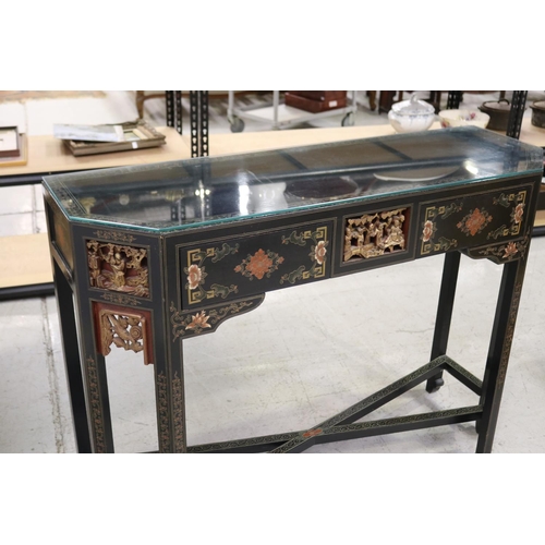 598 - Oriental hall table with two drawers. with chamfered gilt corners, each woth detailed carvings and c... 