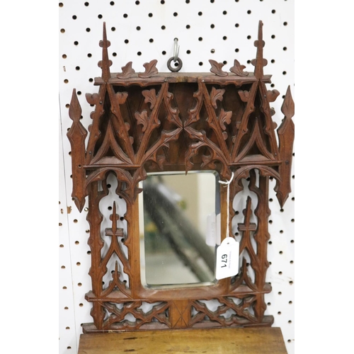 671 - Fine carved pierced timber mirror, with fold-up ledge, approx 46cm H x 23cm W