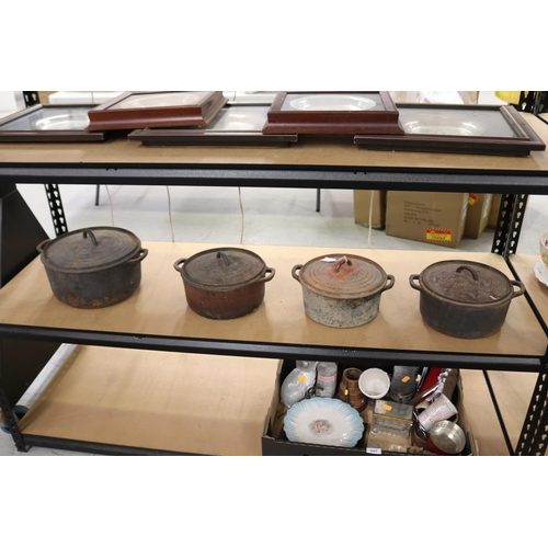 720 - Set of four iron lidded pots (4)