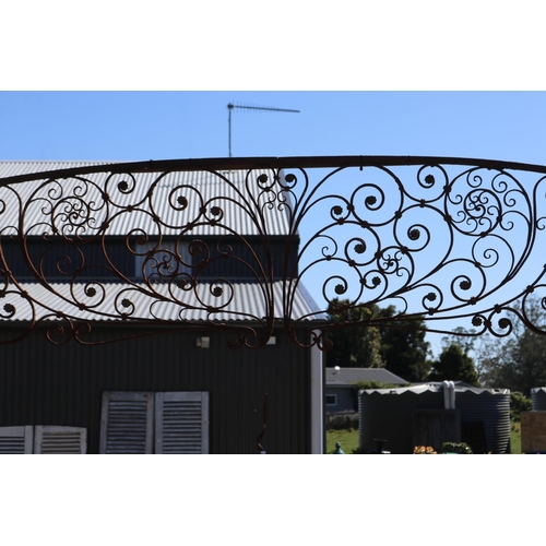 18 - Antique French iron two piece arbor, top section with scrolling iron foliage with applied pressed me... 