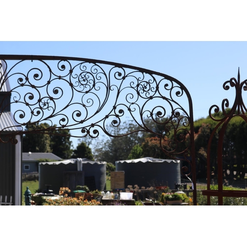18 - Antique French iron two piece arbor, top section with scrolling iron foliage with applied pressed me... 