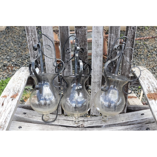 131 - Three metal hanging light fittings, with glass bell shape shades, approx 44cm L   (3)
