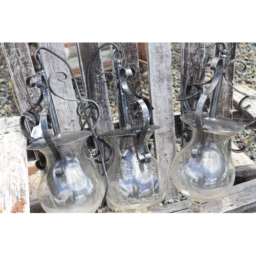 131 - Three metal hanging light fittings, with glass bell shape shades, approx 44cm L   (3)