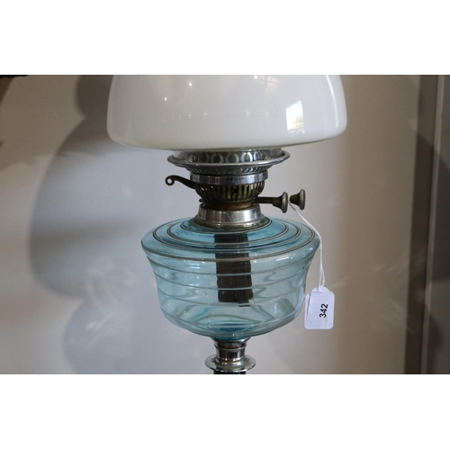 342 - Antique oil lamp, aqua glass reservoir with double burner, stepped chrome with black pottery base, 6... 