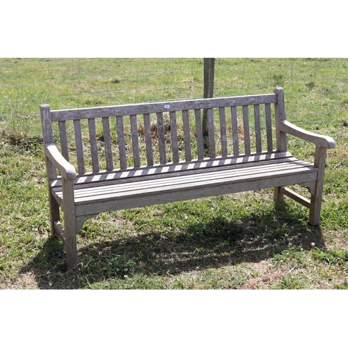 103 - Cottswold Aged teak garden bench, approx 180cm L