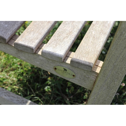 104 - Cottswold Aged teak garden bench, approx 180cm L