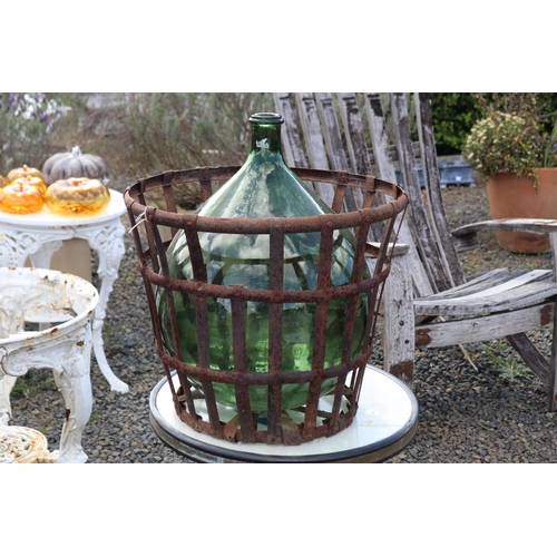 141 - Old French wine makers bottle with wrought iron cage, approx 50cm H