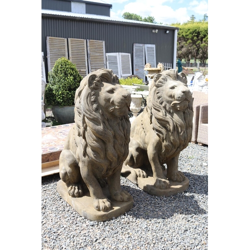 231 - Large pair of cast composite faux sandstone seated lions, approx 133cm H each (2)