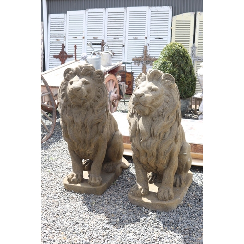 231 - Large pair of cast composite faux sandstone seated lions, approx 133cm H each (2)