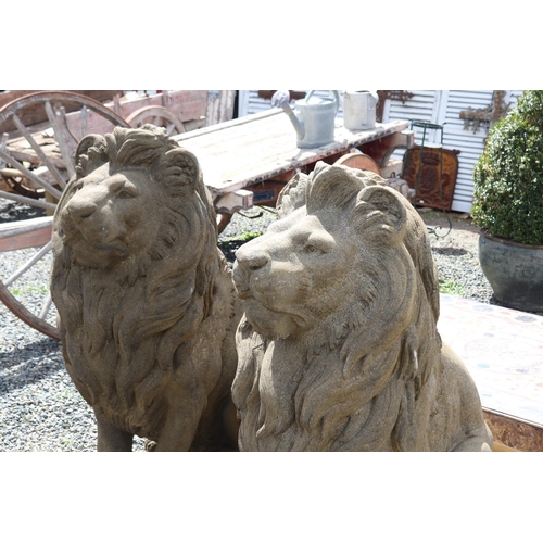 231 - Large pair of cast composite faux sandstone seated lions, approx 133cm H each (2)