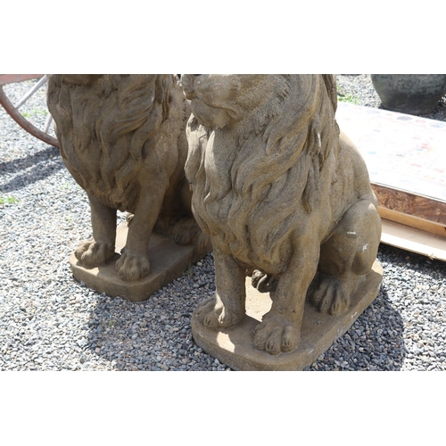 231 - Large pair of cast composite faux sandstone seated lions, approx 133cm H each (2)