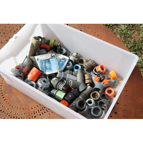 320 - Tub of assorted hose and tap fittings, including sprinkler