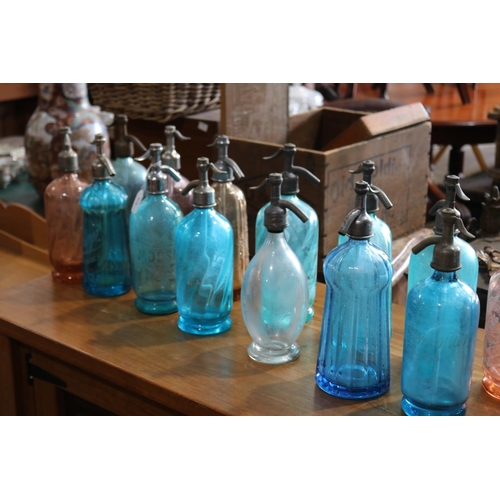 379 - Rare collection of 24 antique (twenty four) French coloured glass soda bottles, most with etched Fre... 