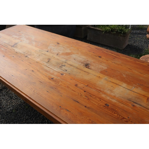 59 - Long recycled pine table, with double stretchers below. Standing on square legs, approx 290 cm long ... 