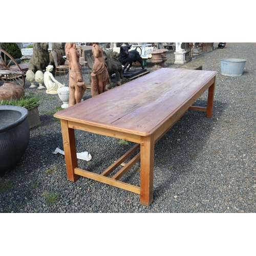 59 - Long recycled pine table, with double stretchers below. Standing on square legs, approx 290 cm long ... 