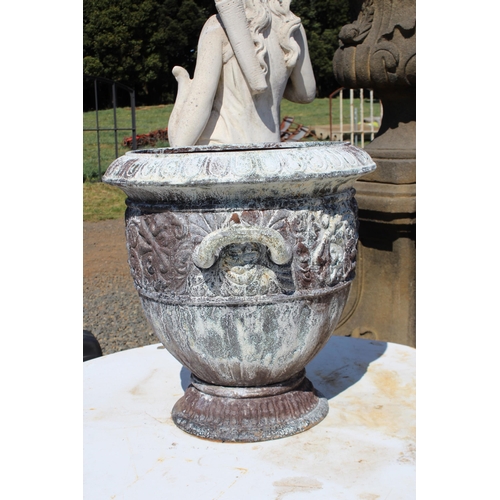 142 - Large antique French cast iron twin handled urn, cast in relief with mask heads of Medusa and scroll... 