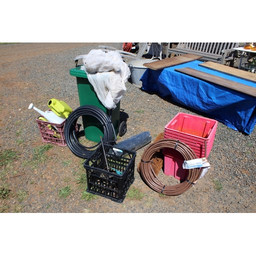 318 - Assortment, green otto bin full of bird netting, stack of red plastic tubs, watering pipes in rolls,... 