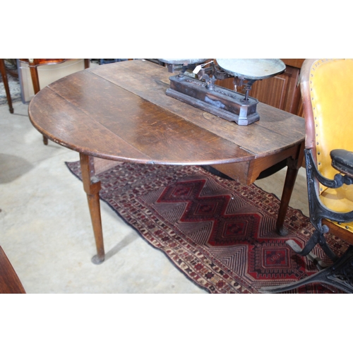 493 - Georgian II oak drop side table, with pad feet, approx 69cm H x 152cm W x 167cm D (with sides up)