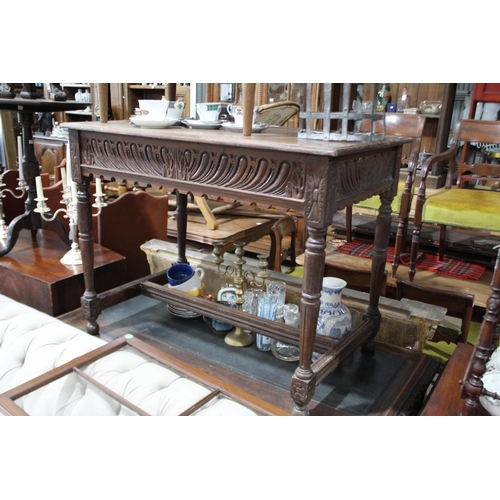 495 - Antique English oak side table, with carved front apron, turned legs joined by a stretcher below, ap... 