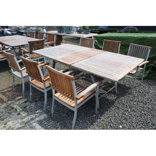 204 - Teak and aluminum extension out door table and matching set of six arm chairs