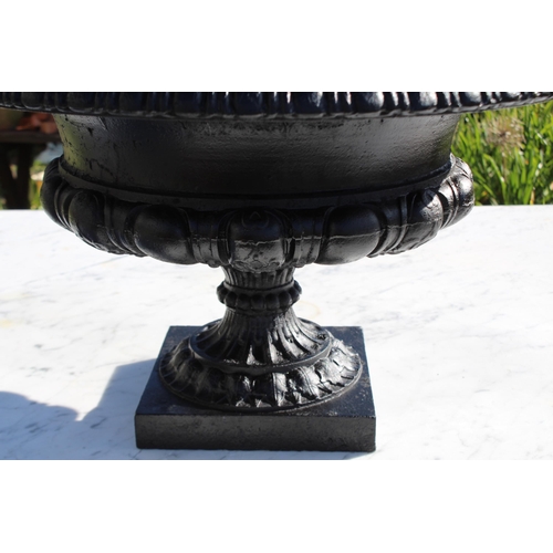 107 - Large antique Cast iron flared rim garden urn, egg and dart rim, cast in relief with scrolling folia... 