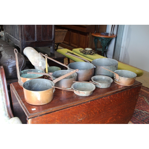 559 - Selection of antique French copper and iron handled sauce pans, approx 25.5cm Dia x 51cm L and small... 