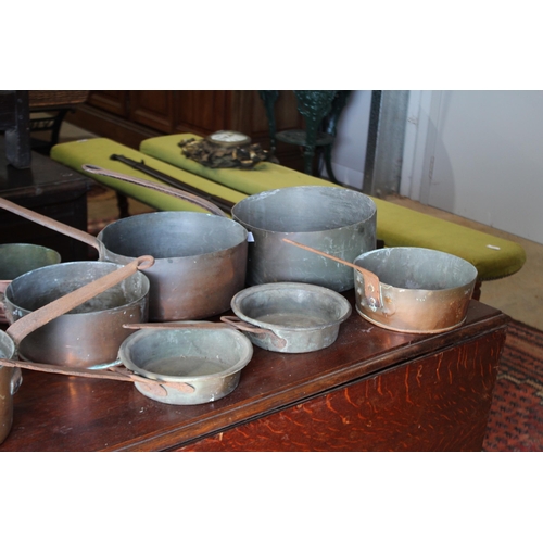 559 - Selection of antique French copper and iron handled sauce pans, approx 25.5cm Dia x 51cm L and small... 