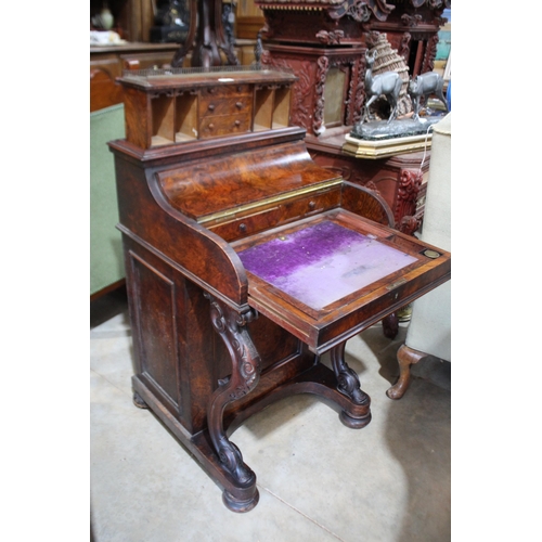 525 - Mid Victorian figred walnut piano top davenport, the curved front enclosing fitted interior and with... 