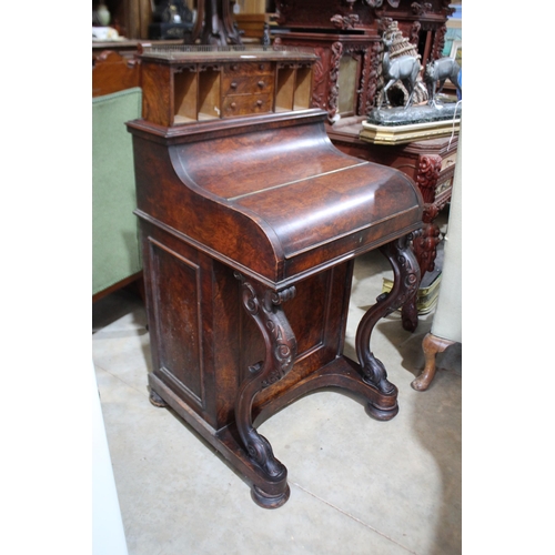 525 - Mid Victorian figred walnut piano top davenport, the curved front enclosing fitted interior and with... 